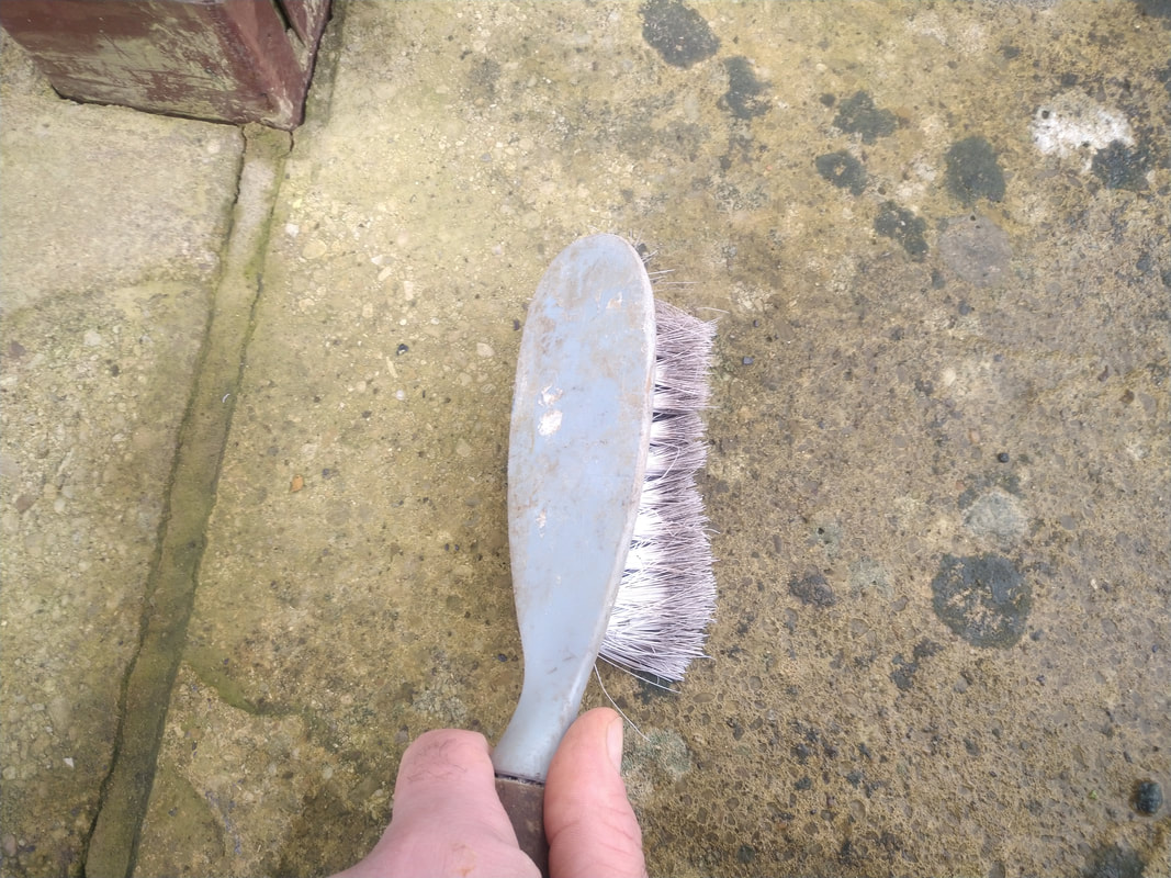 brush cleaning paving