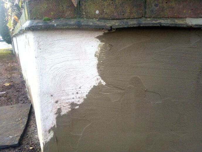 Patching up render on a garden wall