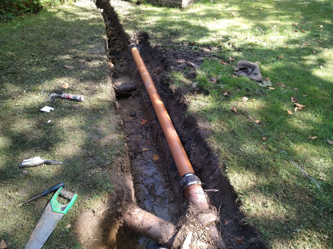 Replacing clay drainage pipes with plastic pipes