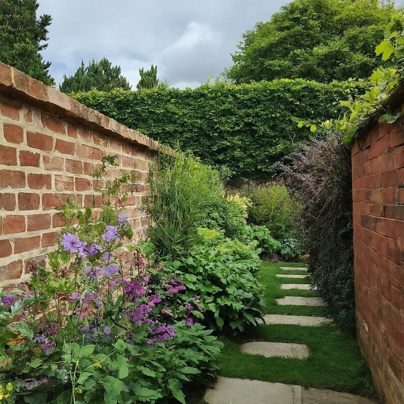 English garden with brick walls