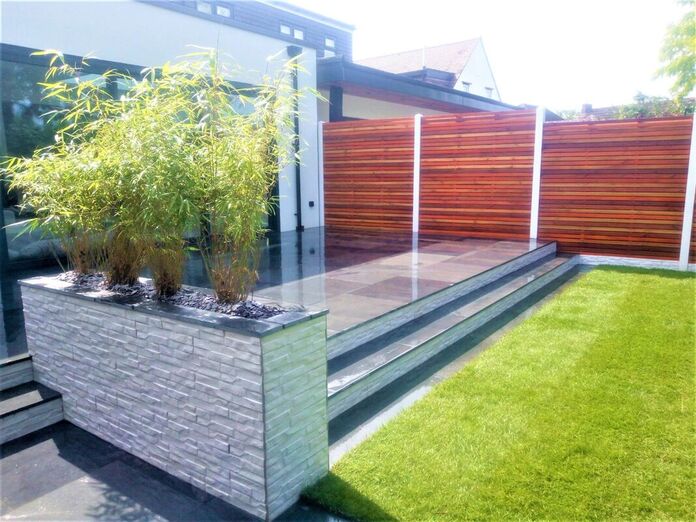 contemporary modern garden with stack cladding