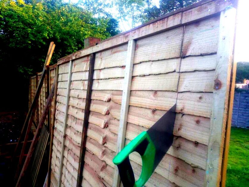 cutting down a fence panel