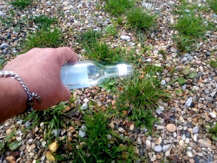 Pouring vodka on weeds