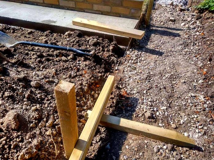 Building a concrete paths shuttering level to a string line